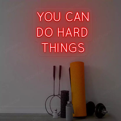 red you can do hard things neon sign mounted on a wall