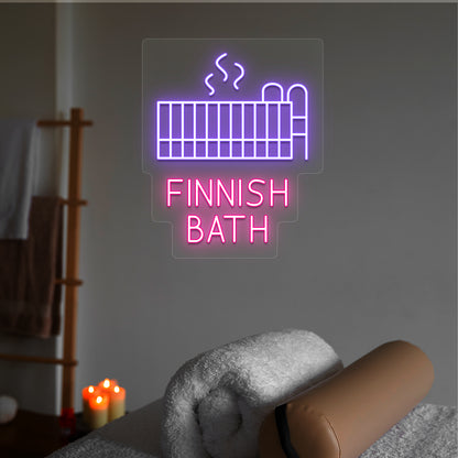 Finnish Bath neon sign in purple and pink colors glowing in a spa room