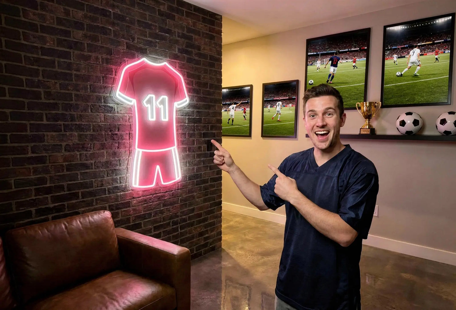 Red glowing football jersey neon artwork with number 11 on brick wall in a sports themed room with framed match photos trophy soccer balls and a man pointing at the sign