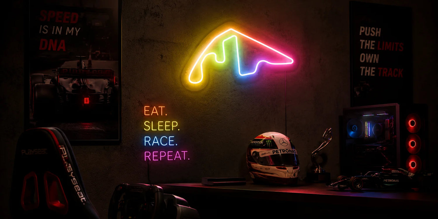Custom RGB Grand Prix Circuit Neon Sign above a motorsport-themed desk with racing helmet and Formula-style model car