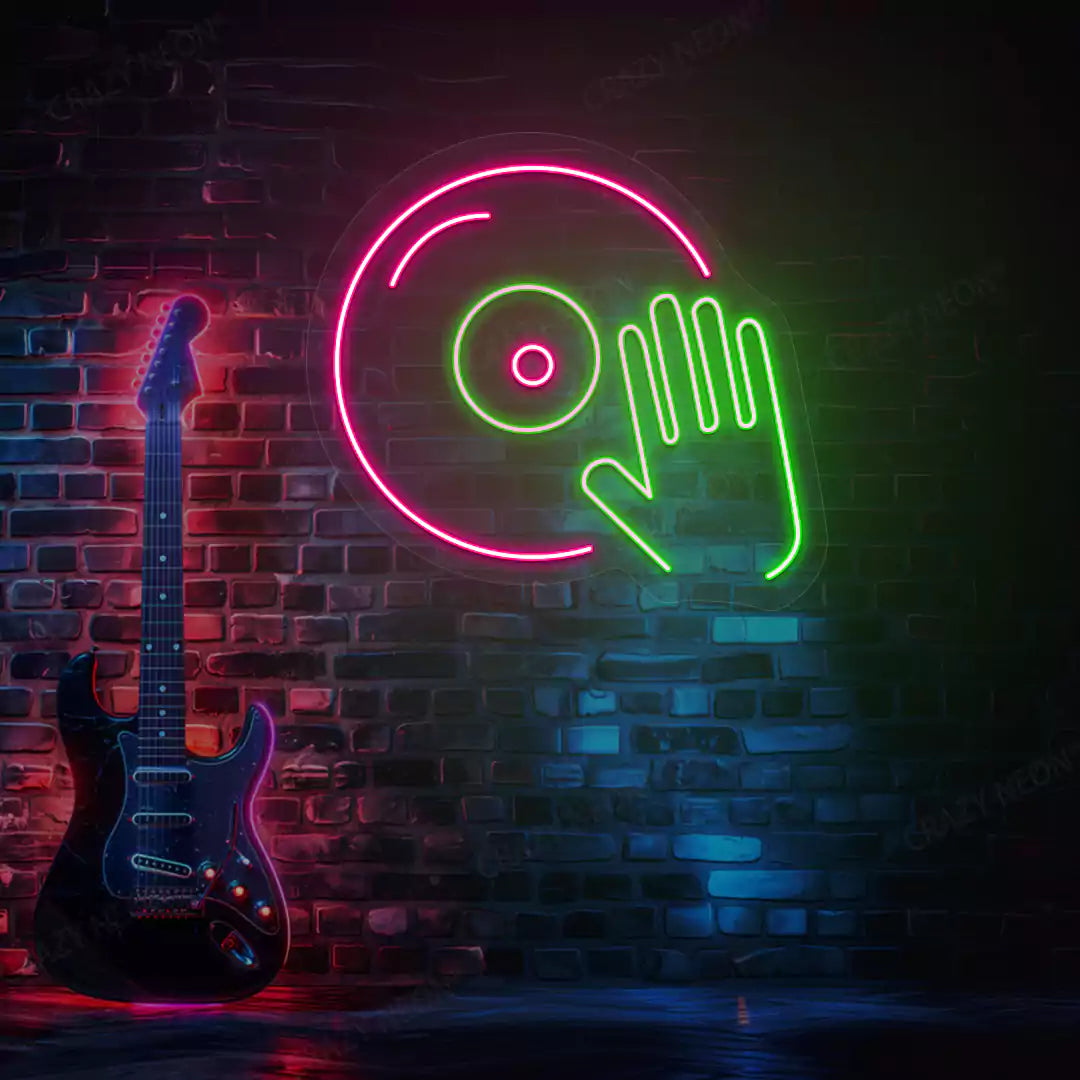 green and pink dj turntable neon sign mounted on a wall