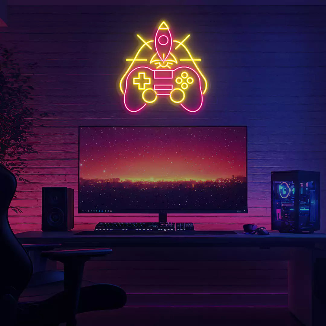 Rocket Gaming Controller Neon Sign in Pink and Yellow Color mounted on a wall 