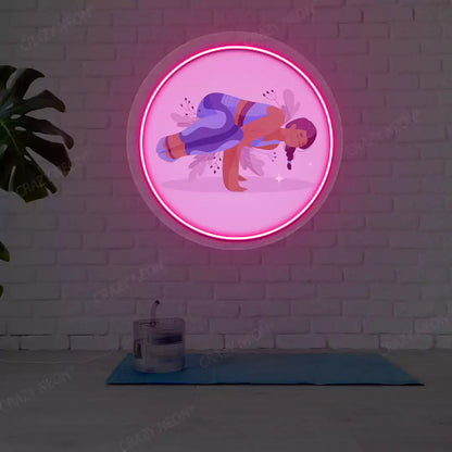 Parsva Bakasana Yoga Neon Artwork lighting up in pink color in a yoga room