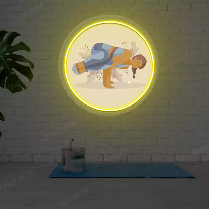 Parsva Bakasana Yoga Neon Artwork lighting up in yellow color in a yoga room