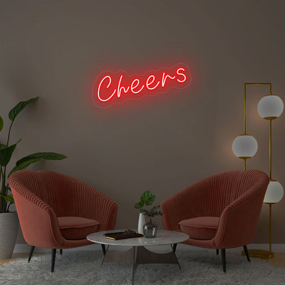 Cheers red neon sign wall decor in modern lounge with velvet chairs and gold floor lamp